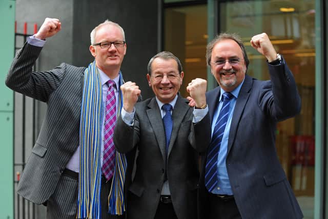 Portsmouth Supporters' Trust board members Ashley Brown, Mick Williams and Mark Trapani celebrate the fans seizing ownership of their club following a High Court hearing in April 2013. Picture: Sarah Standing