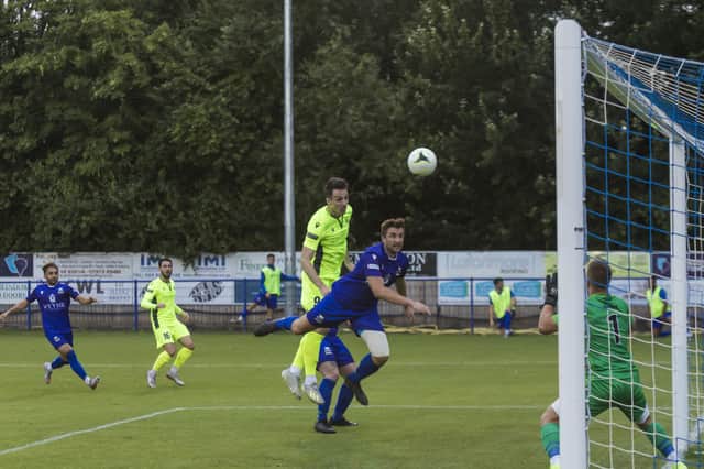 Former Hawks and Bognor striker Jason Prior heads one of his two goals in Dorking's friendly win at Baffins Milton Rovers. Picture: Mike Cooter (270721)