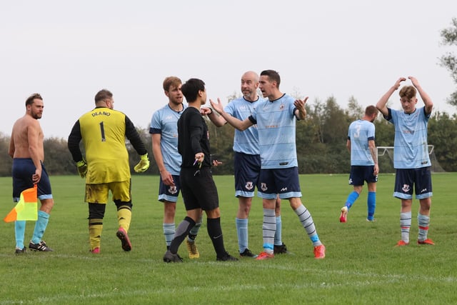Portchester Rovers protest after the referee awards Burrfields a penalty. Picture by Kevin Shipp
