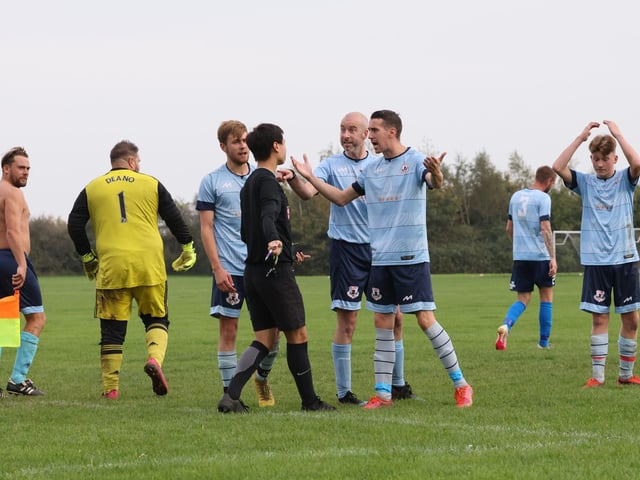 Portchester Rovers protest after the referee awards Burrfields a penalty. Picture by Kevin Shipp