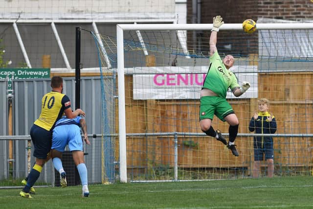 Steve Hutchings' header comes back off the crossbar.

Picture: Neil Marshall