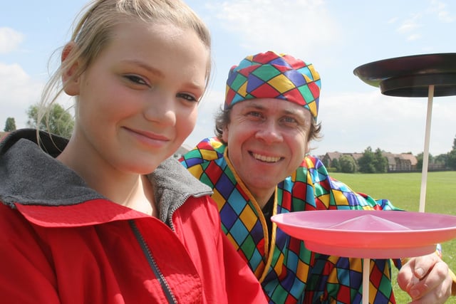 Nadine Piper learns circus skills from entertainer Cheeky Charlie at a summer fete in Deincourt School, North Wingfield, in 2007.