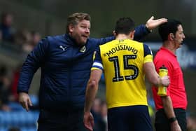 John Mousinho has expressed his disappointment at Karl Robinson's sacking at Oxford United.