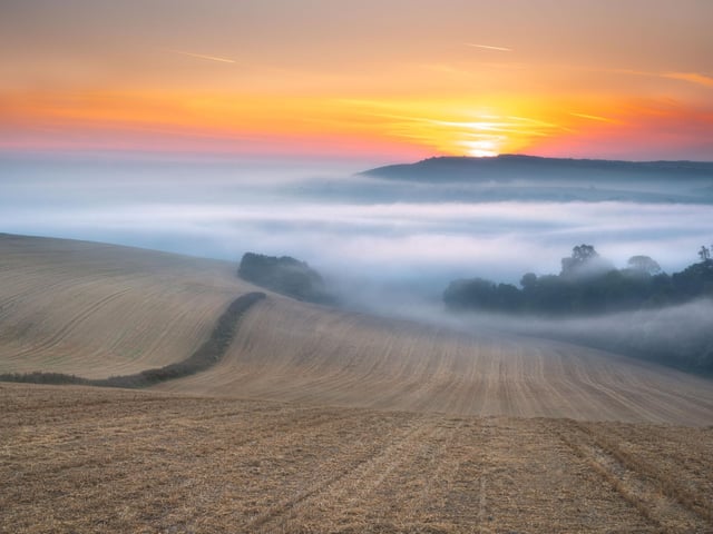 First light over a misty Arun Valley. Picture by Lloyd Lane