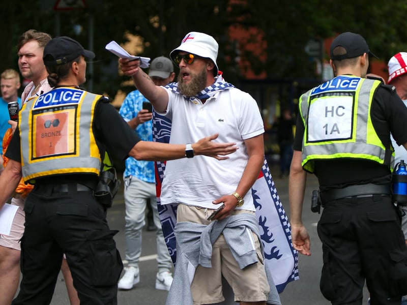 Protestors at Guildhall Square, Portsmouth. Demonstrators having verbal exchanges with officers. Picture: Chris  Moorhouse (030824-54)