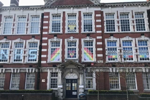 Priory School key worker children have decorated the front of the school building with a rainbow and messages of support for the NHS.