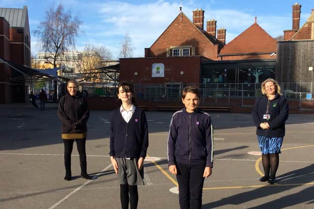Wendy Fowler (right) with children from Milton Park Primary School. Mrs Fowler has written to parents asking them to only send their children to school if they 'really need to'.
