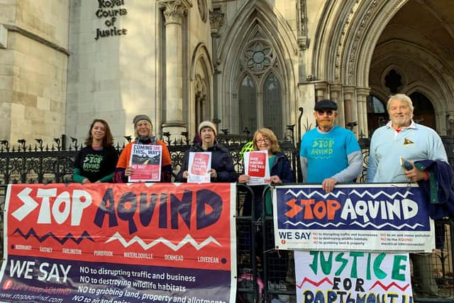 Portsmouth residents and members of the community campaign group Let's Stop Aquind, outside the Royal Courts of Justice in London. The group are opposed to proposals for a £1.2 billion cross-Channel power cable project between Portsmouth and Normandy in France and have brought a High Court challenge in November