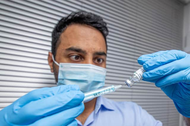 Pictured: Krishan Patel with the Covid vaccine at Goldchem pharmacy, Southsea 
Picture: Habibur Rahman