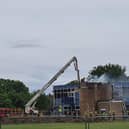 Firefighters pictured at Brune Park Community School fighting a blaze at one of the site's buildings. Photo: Simmone Prager.