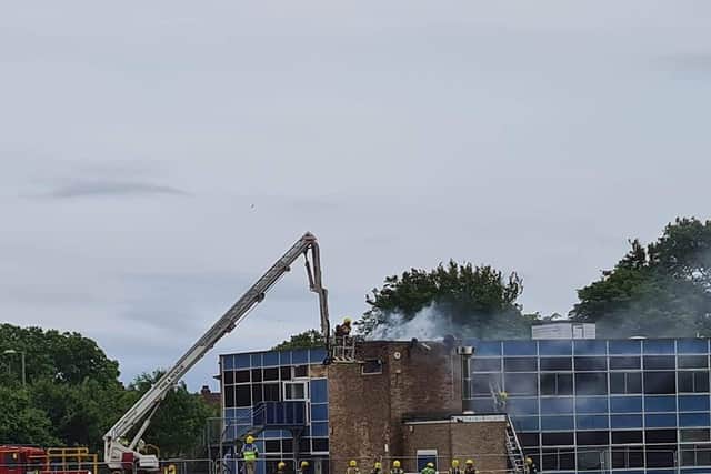 Firefighters pictured at Brune Park Community School fighting a blaze at one of the site's buildings. Photo: Simmone Prager.