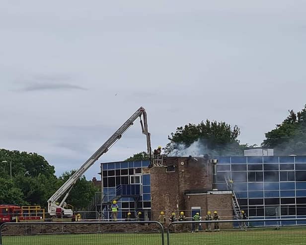 Firefighters pictured at Brune Park Community School fighting a blaze at one of the site's buildings. Photo: Simmone Prager.