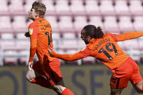 Andy Cannon celebrates his winner at Wigan. Picture: Daniel Chesterton/phcimages.com