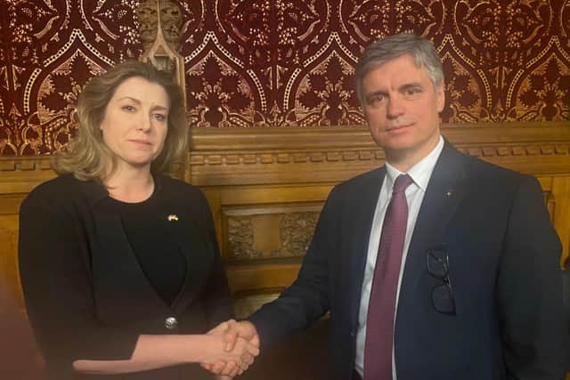 A hand of friendship: Ukraine's ambassador to the UK Vadym Prystaiko shakes the hand of Portsmouth North MP Penny Mordaunt as he praises the city for its efforts supporting Ukraine