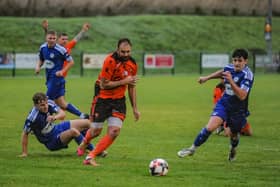 Hat-trick hero Brett Pitman in action for AFC Portchester during the 3-2 win at Portland that took them back into top place in the Wessex League. Picture by Daniel Haswell