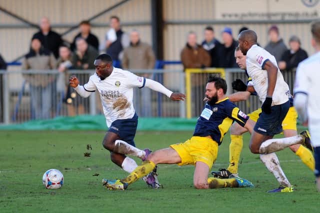 Hawks' Sahr Kabba, left, is tackled by Jamie Brown during his side's 2-1 Boxing Day win over Gosport on Boxing Day, 2013. Picture: Allan Hutchings.