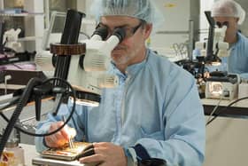 Specialists at BAE Systems work on complex electronics at Broad Oak's 'clean room'. Photo: BAE Systems