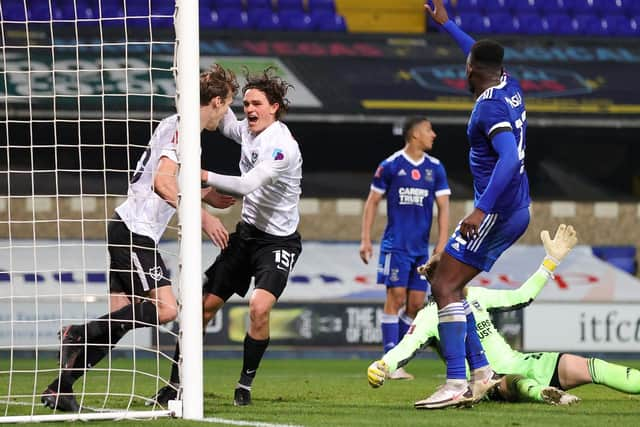 Sean Raggett celebrates his winning goal for Pompey against Ipswich in the FA Cup first round. Picture: Nigel Keene