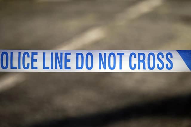 File photo of police tape near a scene of a suspected crime