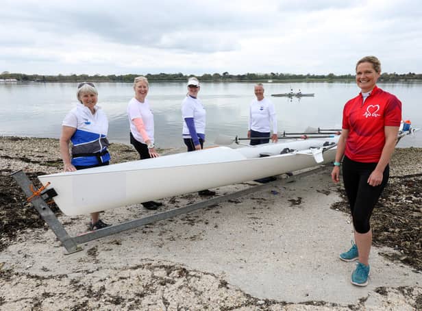 Dr Sophie Bostock, in red, is training to row around the UK in June in aid of the British Heart Foundation. She is pictured along with, from left, Julia Rooke, Andi Davies, Dee Pullen and Andrew Ferrand, at Dolphin Rowing Club, Northney Marina. Picture: Chris Moorhouse (jpns 140521-10)