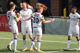 Hawks players come together to celebrate Scott Rendell, second left, netting the fourth goal against Braintree Picture: Dave Haines