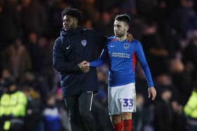 Portsmouth's Ellis Harrison and Portsmouth's Ben Close dejected after the match