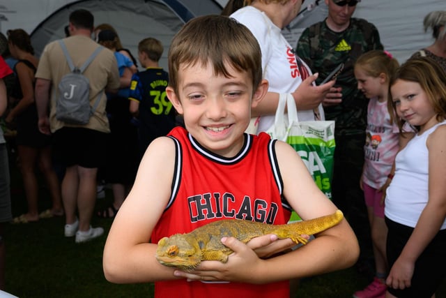 Pictured is: Theo Singleton and Bearded Dragon called 'Scuttle' who has only one leg.Picture: Keith Woodland (230621-65)