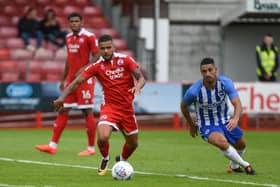 Billy Clifford, left, in action for Crawley Town against Brighton and Hove Albion in  a friendly in 2017. Picture by PW Sporting Photography