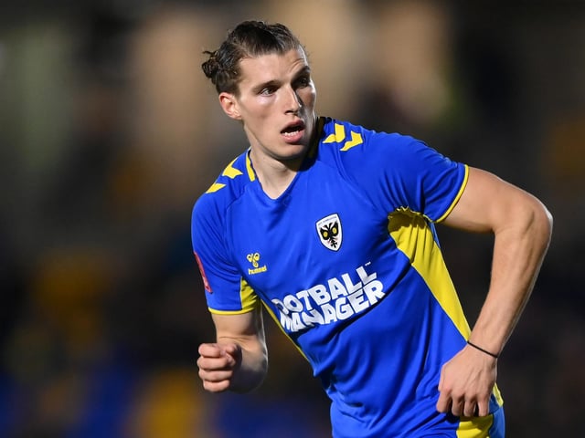 The 22-year-old made the drop to AFC Wimbledon last summer and has impressed in League Two. This has seen him net nine goals in 35 league outings to date and brings an aerial threat in the box. He penned a three-year deal at Plough Lane last summer.