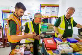 Volunteers packing emergency food parcels