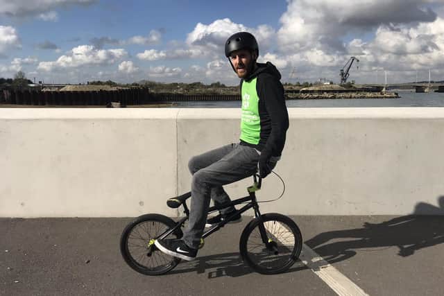 Ben Brooks is taking on a mile each day for 21 days using various methods of unusual transport to raise funds for Portsmouth Down Syndrome Association's T21 Challenge. Pictured: Ben cycling backwards on a BMX