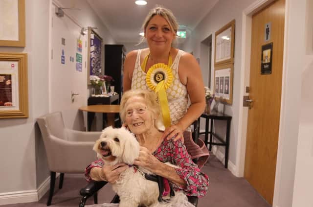 1.	Care UK Bourley Grange resident Audrey and her granddaughter with Daisy, who came third at the home's dog show.