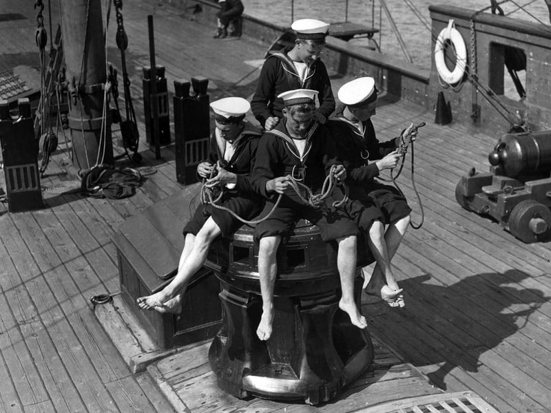 20th August 1936:  Sea Cadets learning how to tie knots on board the training ship 'Implacable' in Portsmouth harbour.  (Photo by E. Dean/Topical Press Agency/Getty Images)