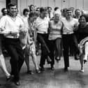 Workers at the Metal Box factory, Copnor, wasted no time in introducing Russian guests from the Obraztsovy to an English knees-up, 1976. Picture: The News PP5040