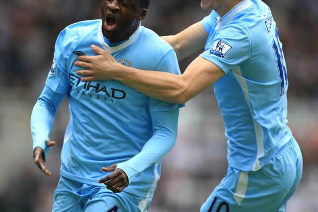 Former Pompey targets Yaya Toure and Edin Dzeko celebrate scoring for Manchester City. Picture: Mike Egerton