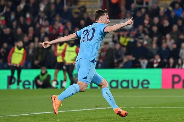 Chris Wood of Newcastle United celebrates scoring their sides first goal of the game during the Premier League match between Southampton and Newcastle United at St Mary's Stadium on March 10, 2022 in Southampton, England. (Photo by Dan Mullan/Getty Images)