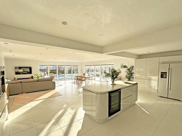 This property comes with six bedrooms, five bathrooms and two reception rooms as well as a swimming pool and a spacious garden.