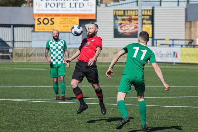 Adam Beckett (Meon, red) v Mob. Pic: Mike Cooter.