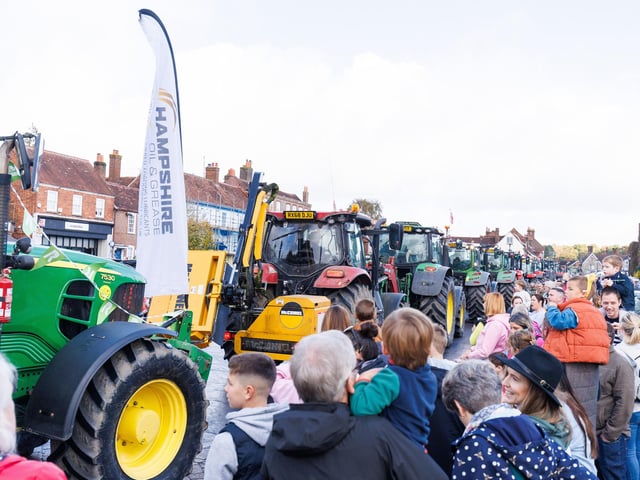 Crowds gathered in Wickham Square to watch the procession of tractors go by all to raise money for Rowans Hospice and Guide Dogs.