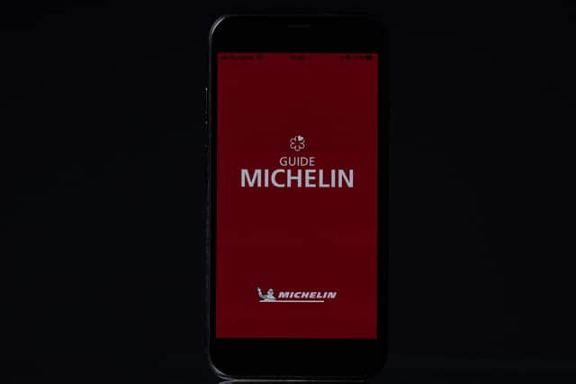 This photograph taken on March 2, 2023, shows the 2023's Michelin Red Guide, the oldest European hotels and restaurants reference guide, viewed on a smart-phone screen in Paris. (Photo by JOEL SAGET / AFP) (Photo by JOEL SAGET/AFP via Getty Images)