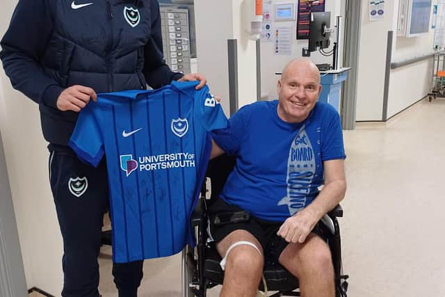 Portsmouth FC player Marlon Pack with patient Mick Clifford