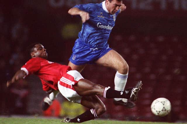 Warren Aspinall takes on Manchester United's Paul Parker in the Rumbelows Cup in October 1991, with the Blues losing 3-1