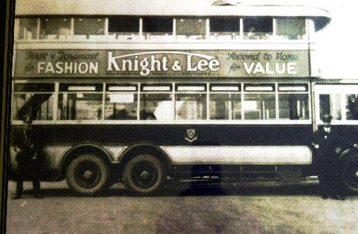 A bus advert for Knight & Lee from the early 20th century