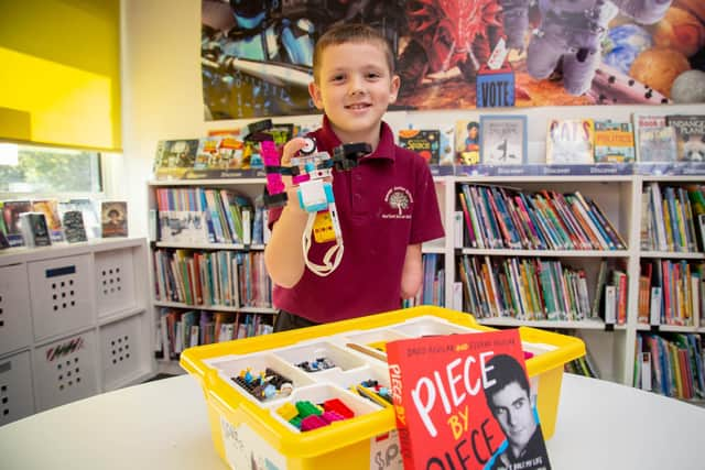 8 year old Albert McCormick who was born with only one arm is a pupil at Rowner Junior, Gosport.
He is being gifted a book and £360 worth of Technic Lego by Stephen Shaw, a Lego trainer at his school.

Pictured: Albert McCormick with his new lego and book at Rowner Junior, Gosport on Wednesday 9th November 2022

Picture: Habibur Rahman