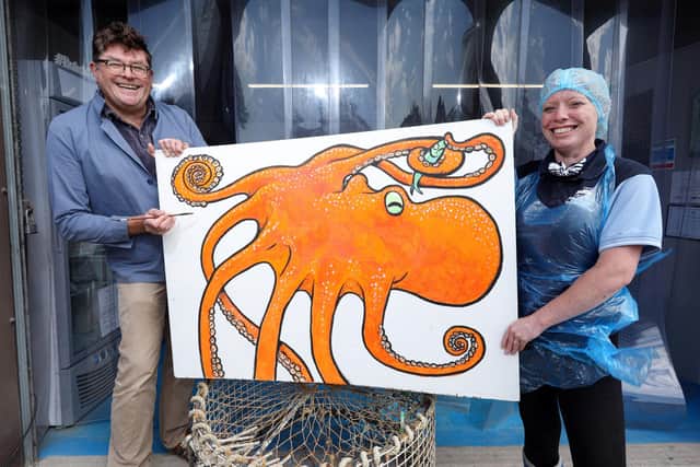 Business owner Chantelle Williams and artist Guy Venables launch Fresh From The Boat's competition to win fish. Picture: Chris Moorhouse (jpns 290721-36)