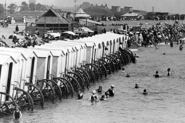 1900:  Holidaymakers enjoying mixed bathing at Southsea, with a line of bathing machines along the shore. Picture: Getty Images