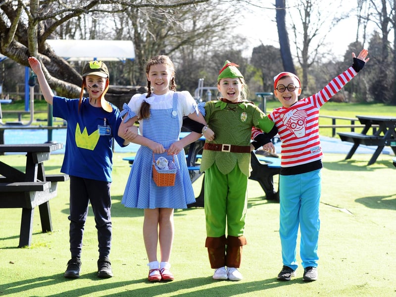 Gomer Junior School in Gosport, dressed as their favourite book characters, baked caked and took part in online quizzes to mark World Book Day.Pictured is: (l-r) Thomas Ricketts (9) as Dog Man, Anna-Lucia Digby (9) as Dorothy, Harriet Slater (10) as Peter Pan and Luca Mayle (8) as Where's Wally.Picture: Sarah Standing (070324-6392)