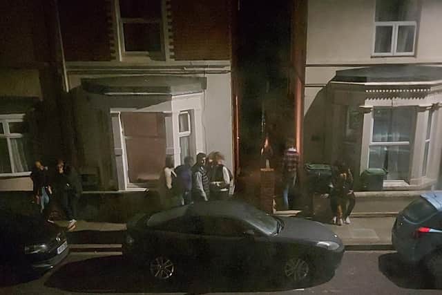 People gathered outside a house in Pains Road, Southsea, on September 13-14.