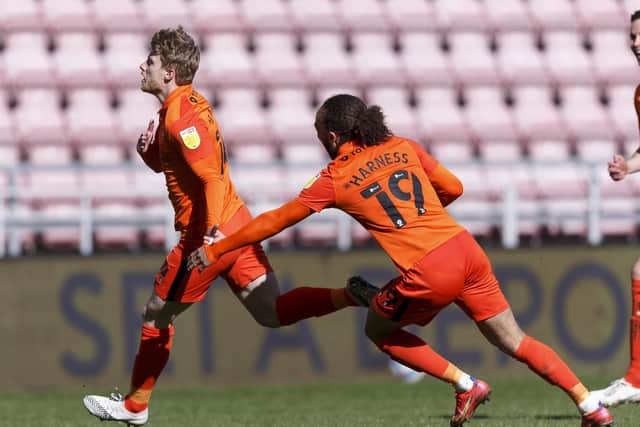 Andy Cannon celebrate his stunning matchwinner at Wigan on Bank Holiday Monday. Picture: Daniel Chesterton/phcimages.com