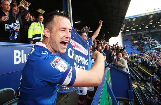 As Pompey's skipper, Michael Doyle led them to the League Two title in May 2017. Picture: Joe Pepler